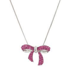 Gift this cute bow pendant to the fashionista in your life! Round-cut pink crystals decorate this petite bow's ribbons, while round-cut white crystals tie the piece together in the center, crafted in sterling silver. Piece measures 3/4 by 1 inches. Comes with a sterling silver 18-inch box chain with a spring ring clasp. The piece comes with a ".925" sterling silver stamp as a symbol of guaranteed product quality. Adorable Bow Design Pink & White Crystals Sterling Silver Measures 3/4 by 1 Inches Pink Ribbon Jewelry As Gift, Pink Ribbon Jewelry Gift, Pink Ribbon Jewelry For Gifts, Elegant Adjustable Jewelry With Pink Bow, Pink Ribbon Jewelry For Formal Occasions, Formal Bow Jewelry For Valentine's Day, Valentine's Day Formal Bow Jewelry, Gift Jewelry With Pink Bow, Valentine's Day Gift Jewelry With Pink Bow