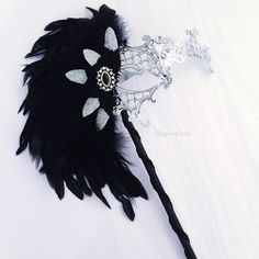 Luxury Silver masquerade women's mask on stick, Feather women's mask C U S T O M I Z A T I O N Leave a check out note if you would like this mask/colors customized! I N C L U D E D Masks come with matching double sided satin ribbons attached. S H I P P I N G - Processed same day or within 24 hours. 1-2 day guaranteed delivery services offered, add items to cart and click on shipping tab for rates. Please leave a check out note with your need date & contact number (especially for expedited an Mascarade Mask Women Silver, Gothic Silver Masquerade Mask For Costume, Silver Fantasy Costume Mask, Silver Gothic Masquerade Mask For Carnival, Elegant Feathered Eye Mask For Masquerade, Masquerade Mask Women, Couples Masquerade Masks, Masquerade Ball Masks, Metal Mask