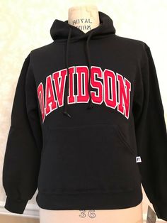 Davidson College Black Hooded Pullover Sweatshirt with Red Lettering Size XS New with tags Bought for a gift - too small, has been in my cedar closet since. Clean and in great, new condition from a non-smoking home Ready for a small person to wear it!   Great gift for a student's sibling. Varsity Cotton Sweatshirt With Logo Print, Cotton Varsity Sweatshirt With Logo Print, Cotton Crew Hoodie With Logo Print, Cotton Hooded Varsity Hoodie, Varsity Cotton Hoodie With Embroidered Logo, Collegiate Hoodie Sweatshirt With Logo Print, Collegiate Logo Print Hoodie Sweatshirt, Collegiate Style Hoodie Sweatshirt With Logo Print, Varsity Cotton Hoodie With Logo Print