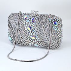 New to our Millennium collection, This beautiful romantic bridal clutch bag is made of very fine quality of rhinestones and metal and it comes with two chains, one chains length is 15 inches for a shoulder bag 45 inches long cross body bag Detachable chain for your Big day! Dimensions- Depth of the bag is 2 inches, length oh the bag is 7.5 inches and width of the bag is 5 inches.   ► ABOUT YOUR ORDER * All items are neatly packaged in our beautiful jewelry boxes and elegant organza bags. * All i Blue Rhinestone Evening Bag For Weddings, Silver Rhinestone Clutch For Gala, Bling Clutch Evening Bag For Wedding, Silver Embellished Crystal Clutch, Rectangular Gala Bag With Rhinestones, Luxury Wedding Clutch With Bling, Crystal Embellished Evening Clutch, Rectangular Embellished Evening Bag For Gala, Silver Crystal Clutch For Wedding