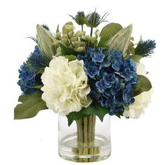 a vase filled with blue and white flowers