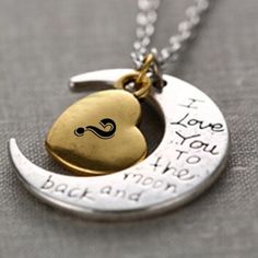 a silver and gold necklace with an i love you to the moon and back on it