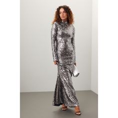 Sliver mesh (95% Polyester, 5% Elastane). Sheath. Long sleeves. Mock neck. Back zipper closure. See Size & Fit notes for measurements. Imported. Metallic Long Sleeve Fitted Sequin Dress, Silver Fitted Sequin Dress For Formal Occasions, Fitted Long Sleeve Silver Sequin Dress, Silver Fitted Long Sleeve Sequin Dress, Metallic Fitted Sequin Evening Dress, Metallic Long Sleeve Sequin Dress For Evening, Metallic Long Sleeve Sequin Evening Dress, Silver Stretch Evening Dress, Sequins Gown