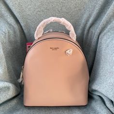 Kate Spade Sloan Backpack Color: Blush Size: 11x10x4 Kate Spade Satchel Backpack With Detachable Strap, Everyday Kate Spade Blush Bag, Kate Spade Standard Backpack With Detachable Strap, Trendy Kate Spade Standard Backpack, Elegant Kate Spade Backpack With Detachable Strap, Trendy Kate Spade Backpack, Elegant Kate Spade Standard Backpack, Chic Backpack For Shopping, Blush Travel Bag With Dust Bag Included