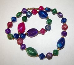 "Multi Color Mardi Gras Style Necklace. Bright Colors of  Multi Shape Beads in Purple, Blue, Green, Pink, with Gold Tone Design/lines on some of the smaller round Beads. Has small Gold tone round Spacers, and a Gold tone Lobster Clasp. The Large Beads have an Iridescent and Marbled look to them. Size: 23 1/2\" Long in Length, and the Largest Beads are 3/4\" in Height. In Excellent Condition. Comes to you in a Brand New Cotton Filled Gift Box.  ** \"REMEMBER MY SHOP POLICIES: \" LOVE IT or RETURN IT\" ** * Please Click Here to Enter My Shop http://www.etsy.com/shop/bettysworld4u?ref=si_shop Thank you for Looking." Color Beaded Necklace, Antler Beads, Large Beads, Precious Moments Figurines, Vintage Cameo, Bone Beads, Labradorite Pendant, Style Necklace, Rhinestone Necklace