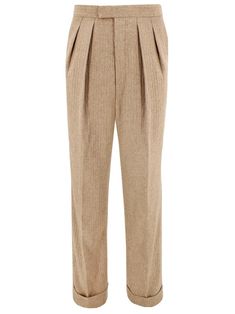 These beige wool blend trousers feature a dapper fishtail back design. The neutral palette and faint stripe of these trousers make them a versatile addition to a vintage lover's wardrobe, easy to pair with statement tweed jackets or a simple piece of knitwear. These trousers share the same cut as our popular Gadabout tropical trousers and are based on an original 40s pair of leisure pants in our archive. Key authentic features include: Vertical side seam pockets. Button fly with French bearer. T 70s Suit, Broad Peak, Beige Hose, Vintage Style Shoes, 40s Style, Tweed Jackets, Vintage Suit, Vintage Knitwear, 1940s Style