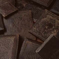 many old books are scattered together on the floor