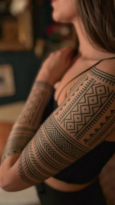 a woman with a tattoo on her arm