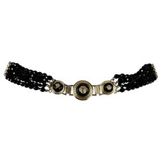 From the Fall/Winter 1994 collection, this black patent leather Gianni Versace belt debuted on the season's runway as part of look 66, modeled by Kate Moss. This stylish belt, designed by the brand's namesake, showcases a black patent leather strap adorned with gold-tone hardware and Versace Medusa emblems. These patent links are connected by strands of black crystal beads and large Medusa gold-tone metal links, adding a luxurious touch to the design. Size - 70 Width: 1" Belt, 1.5" beads Waist: 29" Beads Belt, Beads Waist, Versace Bag, Versace Runway, Crystal Belt, Luxury Belts, Beaded Belt, Versace Belt, Gianni Versace