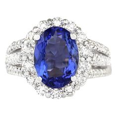 Stamped: 18K White Gold Total Ring Weight: 8.6 Grams Ring Length: N/A Ring Width: N/A Gemstone Weight: Total Tanzanite Weight is 3.77 Carat (Measures: 11.95x8.55 mm) Color: Blue Diamond Weight: Total Diamond Weight is 1.65 Carat Color: F-G, Clarity: VS2-SI1 Face Measures: 16.07x13.60 mm Sku: [703979W] White Gold Ruby Ring, Swirl Diamond Ring, 14k White Gold Diamond Ring, Ruby Ring Gold, Tanzanite Diamond Ring, Tanzanite Diamond, White Gold Set, Bleu Violet, Gold Cocktail Ring