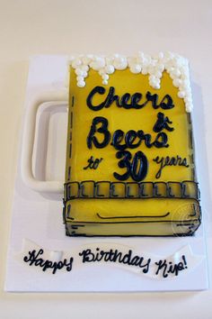 a birthday cake that is shaped like a couch with the words cheers and beers on it