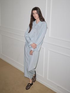 This pajama set features a relaxed fit for comfortable wear experience and shirt design exuding modern and classic mood.- Available in 2 colors: white and blue- Ruffle details at the sleeve to add appeal to the item- Made from a blended fabric with soft touch Light Blue Casual Top For Pajama Party, Casual Light Blue Tops For Pajama Party, Relaxed Fit Long Sleeve Sets For Daywear, Relaxed Fit Light Blue Sleepwear For Loungewear, Relaxed Fit Long Sleeve Sets, Casual Relaxed Fit Sets For Daywear, Chic Relaxed Fit Sleepwear For Lounging, Light Blue Relaxed Fit Sleepwear For Loungewear, Elegant Light Blue Sleepwear For Loungewear