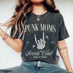 This trendy shirt is the perfect gift for the punk loving mom in your life. You know, the one that has never stopped loving those old pop punk hits and still goes to every reunion concert/festival they can find. Maybe you're the one that can't get enough of that nostalgic, bittersweet feeling. Gift yourself with this comfy shirt and go jam out. Each shirt is custom made at the time you order it. SIZE: ❤ This is a regular unisex t-shirt. NOT automatically oversized. For women, if you like a relax Punk Cotton T-shirt With Funny Print, Edgy Unisex Tops With Letter Print, Punk Style Cotton T-shirt With Funny Print, Funny Print Cotton T-shirt, Unisex Punk T-shirt With Letter Print, Edgy Letter Print T-shirt For Concerts, Black Punk Top With Custom Print, Edgy Tops With Letter Print For Alternative Fashion, Black Custom Print Punk Top