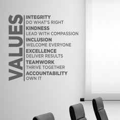 a conference room with chairs and a large wall decal that says value, do what's right