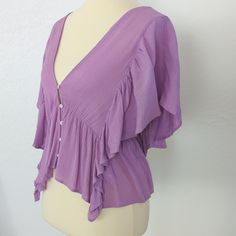 Orchid/Lavender Colored, Low Tieback, Cropped With Longer Sides. Deep V Front And Back. 100 Percent Rayon. Angel Wing Arms. Similar To Free People's Valentina Blouse. Approximate Measures: Underarm To Underarm 17 And 3/4 Inches Length 20 At The Shortest Point, 22 At The Longest Lavender V-neck Summer Blouse, Purple Summer Blouse For Brunch, Fitted Lavender V-neck Blouse, Summer Purple Blouse For Brunch, Purple Short Sleeve Top For Brunch, Lavender V-neck Top For Vacation, Purple V-neck Blouse For Summer, Feminine Lavender V-neck Top, Purple Summer Tops For Brunch