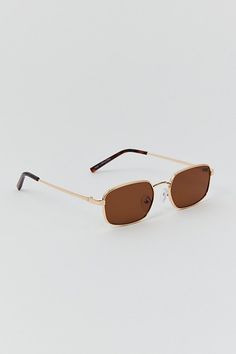 Rectangular sunglasses in a metal silhouette and fitted with padding at the nose bridge. Finished with tinted UV-blocking lenses. Features Slim silhouette sunglasses Padded nose bridge Tinted lenses Content + Care Nickel, stainless steel, polycarbonate Wipe clean Imported Size + Fit Bridge: 18mm Width: 53mm Height: 36mm | Leo Slim Metal Sunglasses in Brown at Urban Outfitters Modern Polarized Sunglasses By Urban Outfitters, Modern Polarized Sunglasses From Urban Outfitters, Urban Outfitters Sunglasses With Uv Protection For Summer, Modern Urban Outfitters Sunglasses With Polarized Lenses, Summer Tinted Sunglasses From Urban Outfitters, Urban Outfitters Tinted Sunglasses For Summer, Urban Outfitters Sunglasses With Mirrored Lenses For Summer, Summer Polarized Sunglasses By Urban Outfitters, Metal Sunglasses