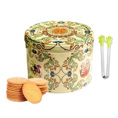 a cookie tin with some cookies in front of it