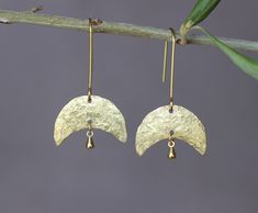 "You will receive one pair of brass earrings from my brass jewelry collection. You can see the whole collection here: https://www.etsy.com/shop/ARTISUNtis?ref=seller-platform-mcnav&section_id=42470765 * Half Moon earrings with tiny rain drop on it * hammered earrings - hammered by hand for texture and unique pattern design * lightweight earrings - it is a pleasure to wear them * minimalist earrings - simple, but elegant design * everyday earrings and for special occasions * Perfect gift - suitable for gift to you or to the special one in your life * including \"care instructions\" * raw brass ear wire hook earrings About material: Brass is a sturdy metal - combination of zinc and copper.  For that reason will naturally tarnish when exposed to oxygen.  Often used in fashion jewelry, brass d Raw Brass Jewelry, Delicate Brass Earrings, Jewelry Smithing, Moon Earrings Gold, Brass Earrings Handmade, Brass Jewellery, Half Moon Earrings, Metal Jewellery, Hammered Earrings