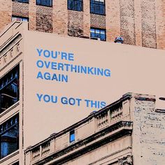 an advertisement on the side of a building that says you're overthiking again you got this