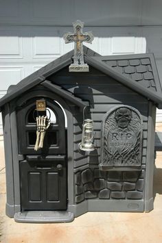 a dog house with a skeleton on the door