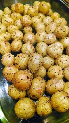 potatoes with seasoning in a glass dish