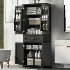 a bathroom with a sink, cabinet and bathtub