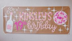 a brown birthday sign hanging on the wall