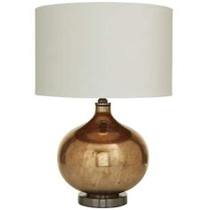 a lamp with a white shade on top of it and a silver base around the bottom