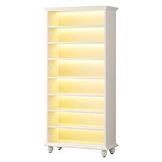 a white bookcase with yellow lights on it's sides and wheels, against a white background