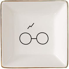 a harry potter square plate with the glasses drawn on it's front and side