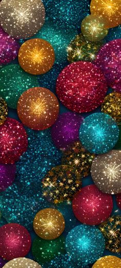 many different colored balls and glitters on a blue background with gold, red, green and