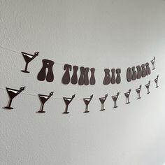 there are many glasses hanging on the wall