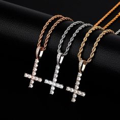 This Upside Down Cross Necklace is a stylish and trendy necklace designed for those who love hip-hop fashion. The necklace features a pendant that is studded with sparkling cubic zirconia stones, providing a dazzling effect. The pendant comes in different designs, including letters, numbers, symbols, and figurines. The necklace chain is made of high-quality metal, such as stainless steel or brass, to ensure durability and long-lasting shine. The necklace is available in different lengths to fit Upside Down Cross Necklace, Cross Necklace Mens, Upside Down Cross, Numbers Symbols, Necklace Mens, Gold Rope Chains, Mens Bracelet Silver, Trendy Necklaces, Copper Necklace