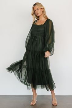 Step into elegance with our tulle maxi dress, complete with long sleeves and an adjustable waist belt. This enchanting dress combines grace and versatility, allowing you to effortlessly create a flattering silhouette for any occasion. Green Flowy Dress, Maxi Dress Dark, Enchanting Dress, Forest Green Dresses, Magical Dress, Tulle Maxi Dress, Dark Green Dress, Baltic Born, Dark Green Color