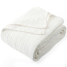 a white blanket folded on top of each other