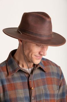 Image Brown Leather Fedora For Rodeo, Brown Leather Wide Brim Hat, Rugged Leather Hat Bands For Ranch, Leather Fedora For Rodeo With Short Brim, Leather Fedora Hats For Rodeo, Leather Brimmed Fedora For Rodeo, Western Leather Fedora With Flat Brim, Brown Leather Fedora Hat, Western Style Leather Fedora With Flat Brim