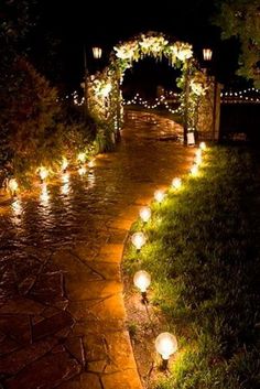 an image of a path that is decorated with lights