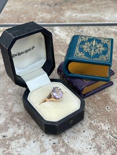 This ring is a one of a kind with lovely a oval faceted Rose de France Amethyst set in a multi prong mounting with miniature leaf details around it. The stone measures 10.25X8.50X5.00 millimeters, the ring is in 14 karat rose gold and is currently a size 5.25 and could easily go up in size or down within reason. The ring weighs a total of 2.60 grams.  Condition details: the prongs are worn and two prong tips are gone, the stone has some chips. There are signs of previous repair but all around th Amethyst Set, Solitaire Rings, Solitaire Ring, Rose Gold Ring, Gold Ring, Gold Rings, Amethyst, Repair, Rose Gold