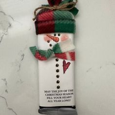 a christmas ornament with a snowman on it