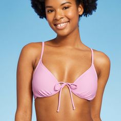 Women's Tie Detail Underwire Bikini Top from Wild Fable™ with front tie detail and underwire for extra support. Soft and stretchy fabric construction, in a solid color. Adjustable straps with back hook closure provide a snug fit. Removable cups offer customizable coverage. Wild Fable™: A look for every story. If you’re not satisfied with any Target Owned Brand item, return it within one year with a receipt for an exchange or a refund. Solid Color Swimwear With Knotted Straps For Poolside, Solid Color Swimwear With Knotted Straps For Beachwear, Solid Swimwear With Knotted Straps For Poolside, Solid Color Strappy Swimwear With Tie Back, Strappy Tie-back Swimwear, Solid Swimwear With Knotted Straps For Vacation, Triangle Top Swimwear With Knotted Straps For Swimming, Underwire Beachwear Swimwear With Knotted Straps, Beach Swimwear With Knotted Straps And Underwire