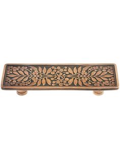 an ornate wooden door handle on a white background