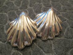 "Beautiful solid sterling silver designer earrings, nicely made, heavier weight, but not heavy on your ear! These were made in Mexico in the 70's, new old stock, never worn. They measure about 1 3/4\" long, and weigh 15.9gms. Hallmarked 925, and Mexico. Low pricing as always." Silver Shell-shaped Jewelry, Elegant Shell-shaped Metal Earrings, Handmade Silver Shell-shaped Earrings, Silver Shell-shaped Earrings, Vintage Shell-shaped Jewelry For Beach, Beachy Earrings, Silver Emerald Ring, Tropical Earrings, Oval Stud Earrings