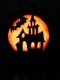 a pumpkin carved to look like a castle