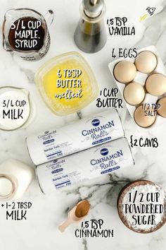 ingredients to make an easy recipe for eggs and cinnamon buns on a marble countertop