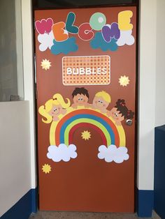 a door decorated with children's pictures and the words bubble bubbles