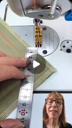 a woman is using a sewing machine to sew on the side of a piece of fabric