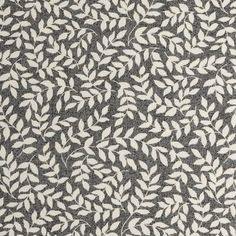 a black and white rug with leaves on it