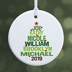 a christmas ornament hanging from a tree with the words, joe kalthy nicole william brooklyn michael