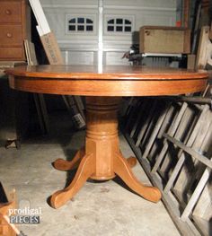 a wooden table sitting inside of a garage