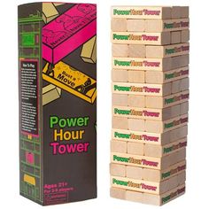 a stack of wooden blocks sitting next to a cardboard box with the word power hour on it